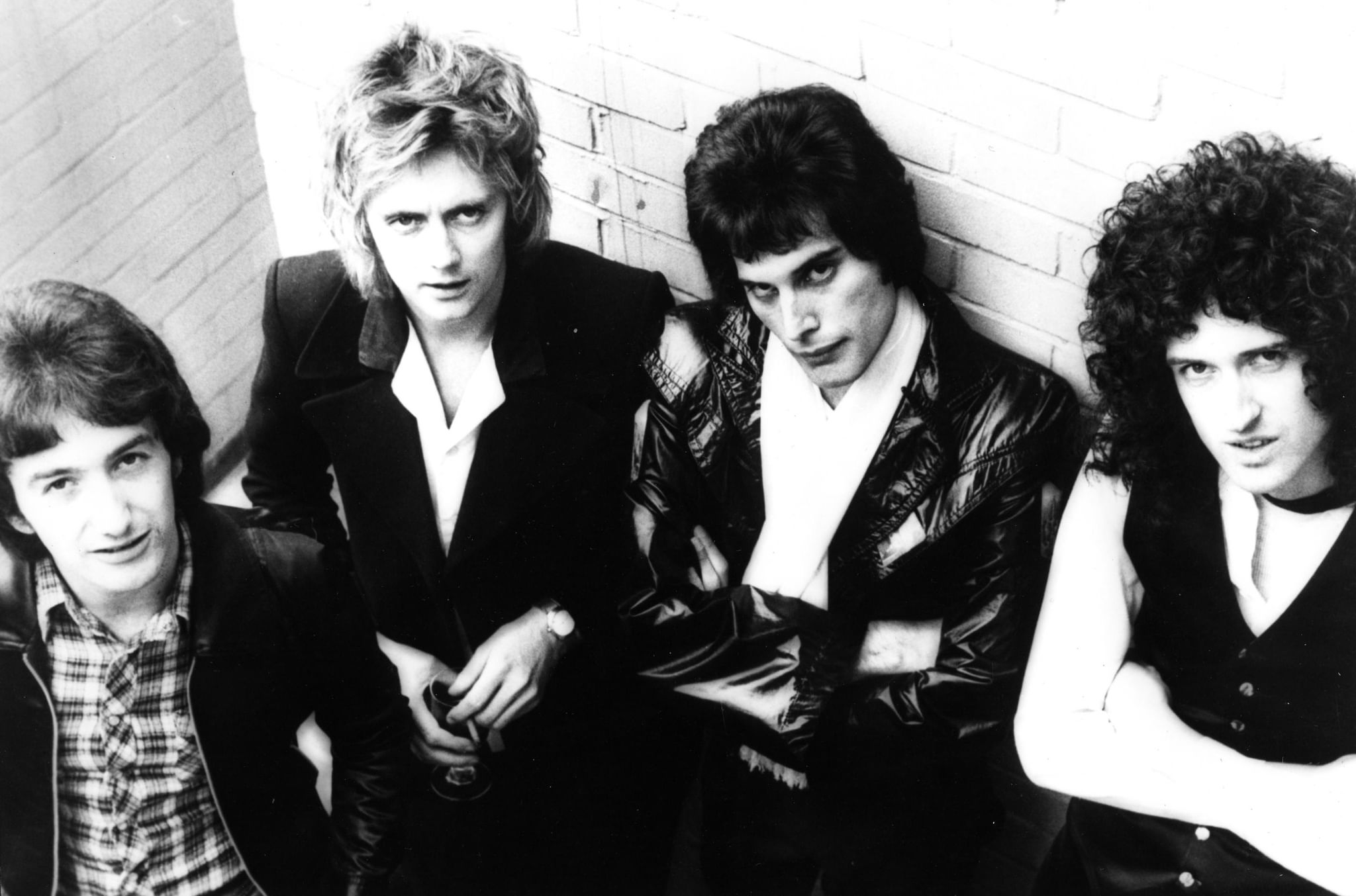 Queen — Deacon, Taylor, Mercury, May — News of the World press kit, 1977